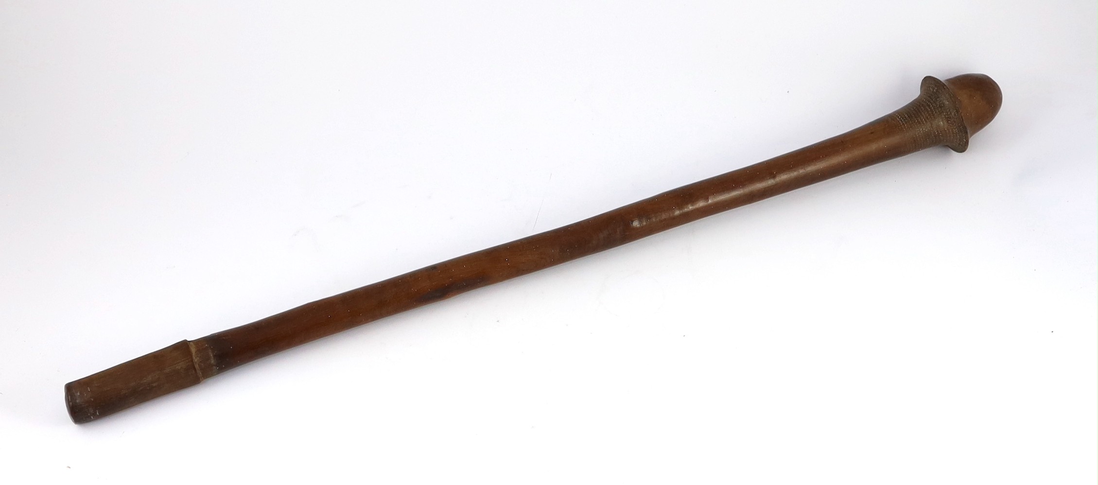 A South Sea Island hardwood war club, with chevron banded engraving beneath the head and unpolished handle, 79cm long